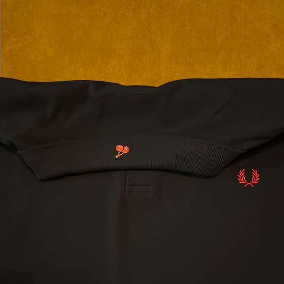 Fred Perry Black Polo Shirt with Unique Sleeve Design and Decorative Hem - Picture 6 of 6